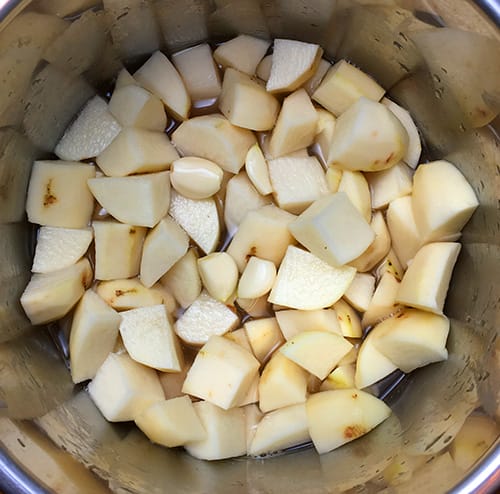 Russet potatoes cut into 1 inch chunks ready to me pressure cooked.