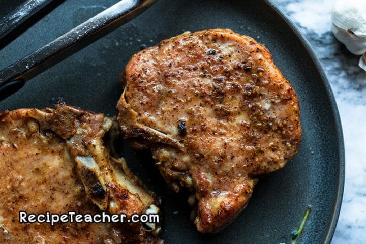 recipe for smotherd creamy garlic pork chops in an Instant Pot pressure cooker.