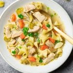 A bowl of chicken noodle soup that was made in an Instant Pot pressure cooker.