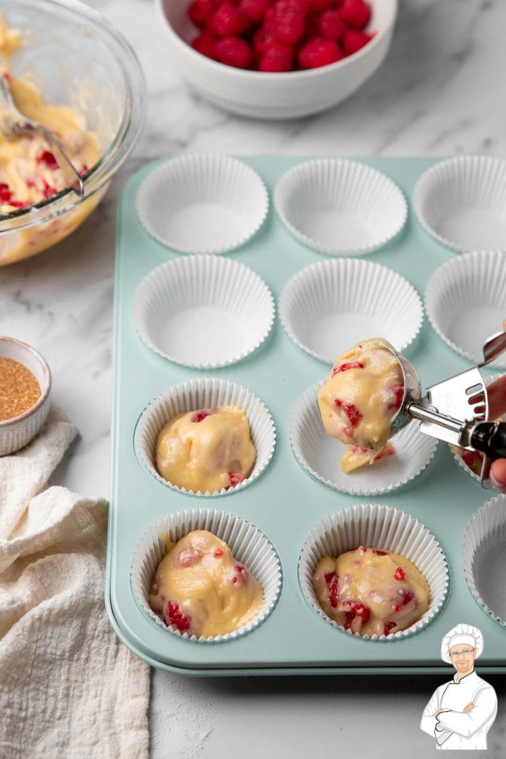 Making raspberry muffins.