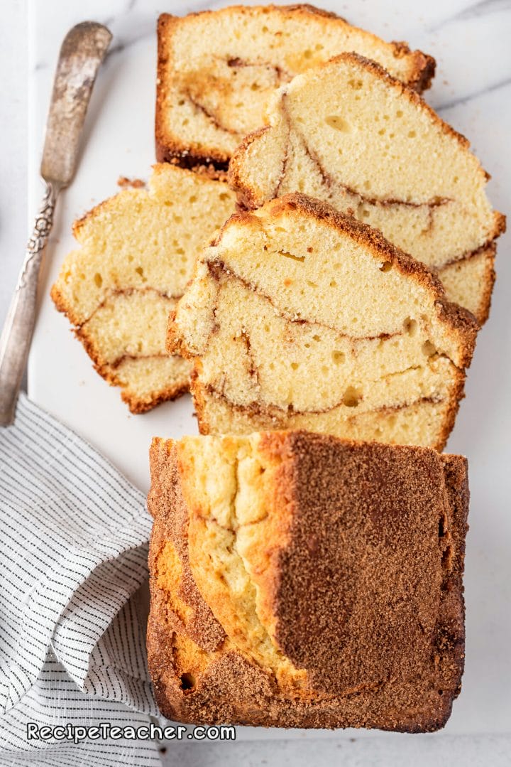 a cinnamon swirl loaf cut into slices ready to serve