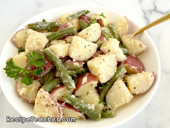Instant Pot Red Potatoes with Green beans in a creamy Parmesan garlic sauce.