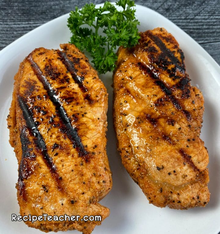 Boneless pork chops cooked on a George Foreman Grill.