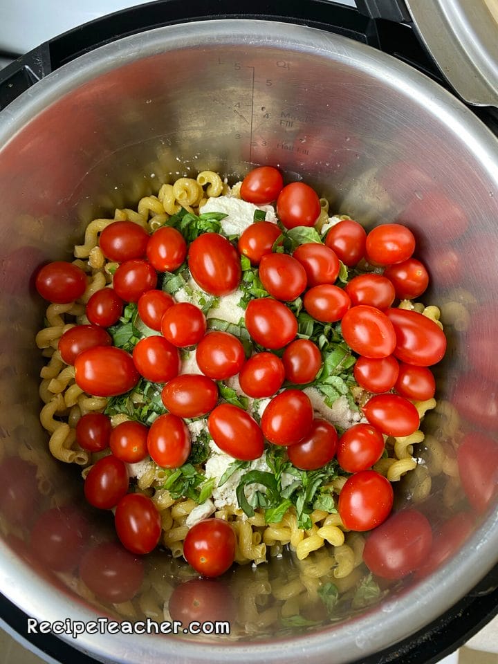 Recipe for Instant Pot Feta Cheese pasta with basil and cherry tomatoes.