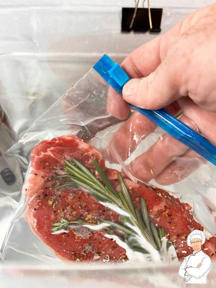 Using the water displacement method to vacuum seal food for sous vide cooking.