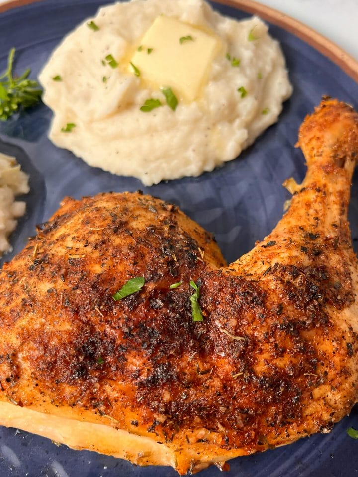 Perfectly cooked, oven baked chicken quarters served with coleslaw and mashed potatoes.