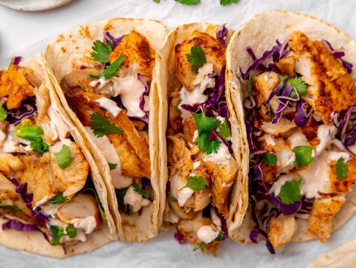 delicious fish tacos topped with a zesty lime crema sauce.