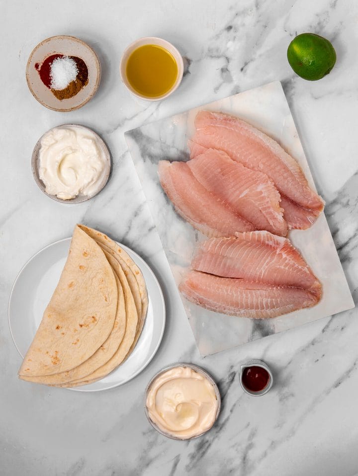All the ingredients to make mouthwatering sheet pan fish tacos.