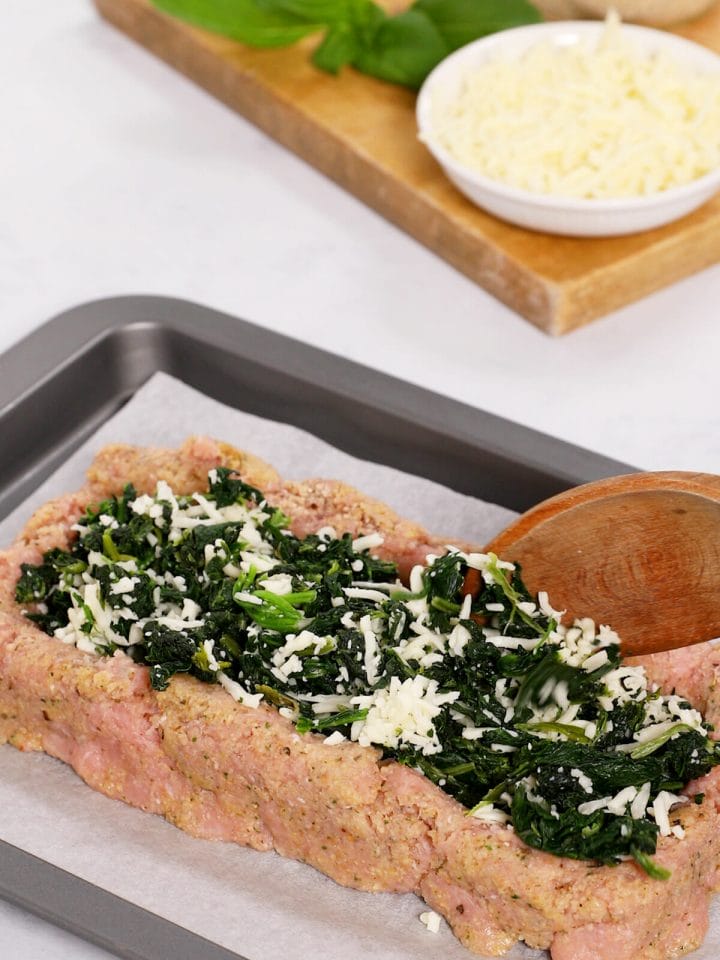 Adding the spinach and mozzarella to our stuffed turkey meatloaf.