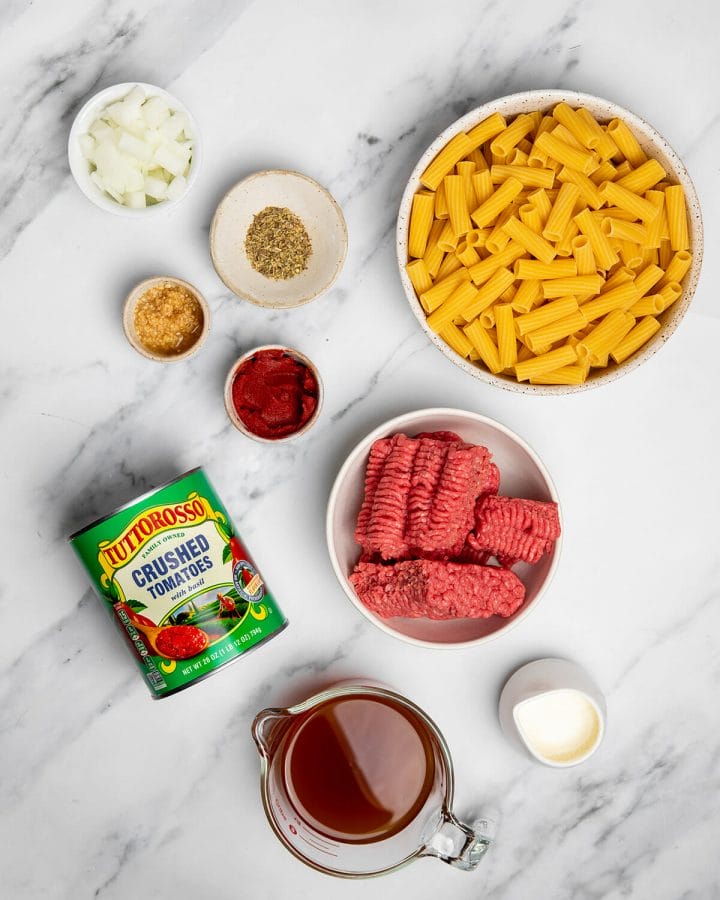 All the ingredients needed to make one-pot pasta with meat sauce.