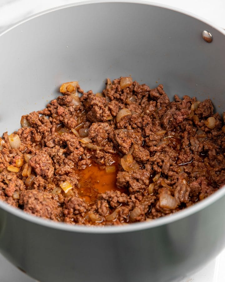 Browning ground beef and other ingredients for our homemade one-pot pasta with meat sauce.