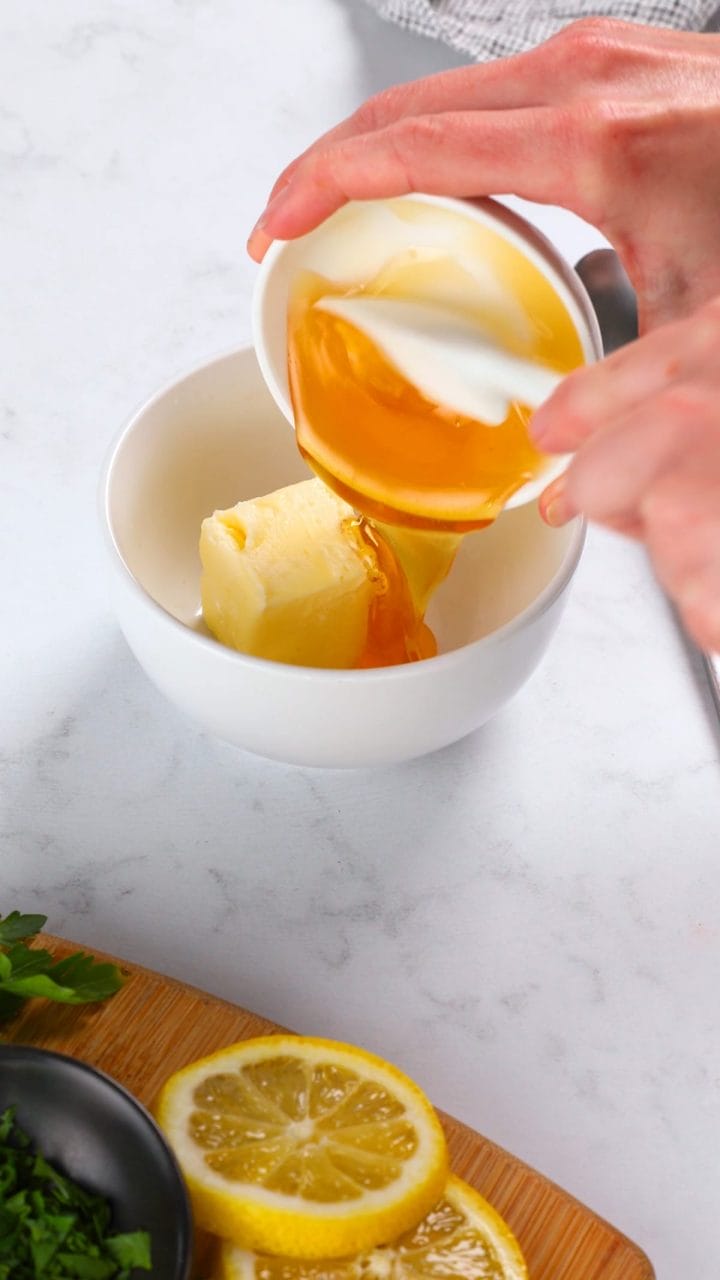 Mixing honey garlic butter for a salmon recipe.
