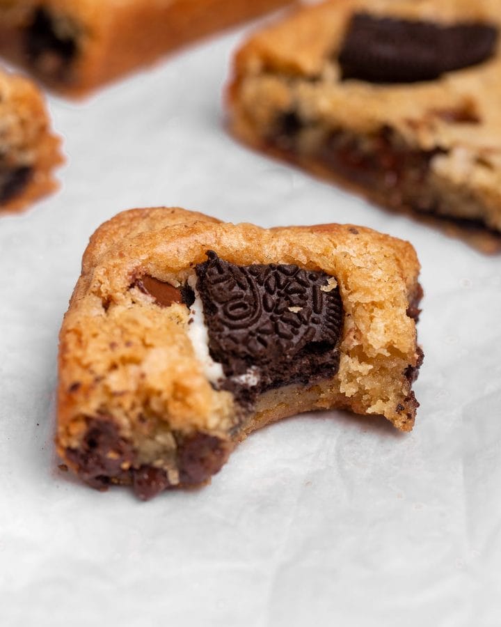 An oreo blondie with a bite taken out of it.