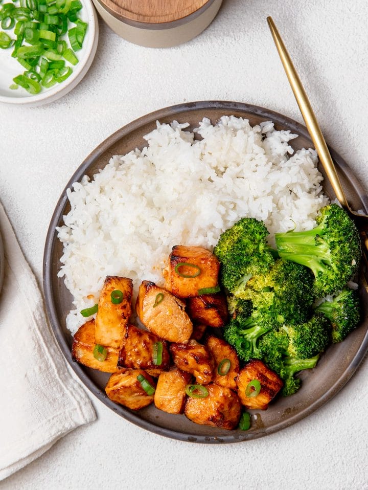 Air fryer salmon bites served with white rice and broccoli. 